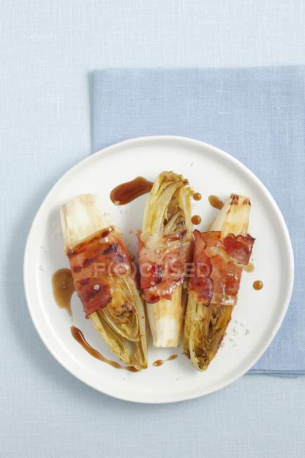 Grilled chicory with ham — Stock Photo