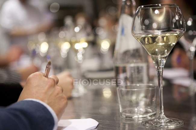 Glass of white wine on bar counter — Stock Photo