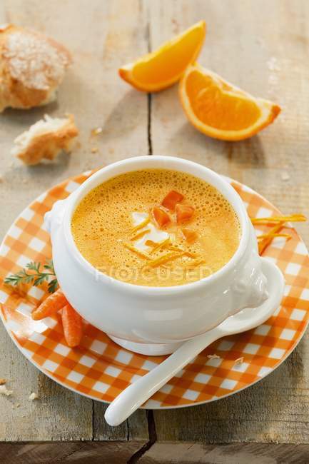 Carrot and orange soup with creme fraiche — Stock Photo