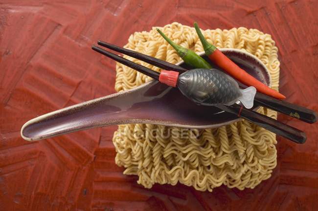 Dried egg noodles and soup spoon — Stock Photo