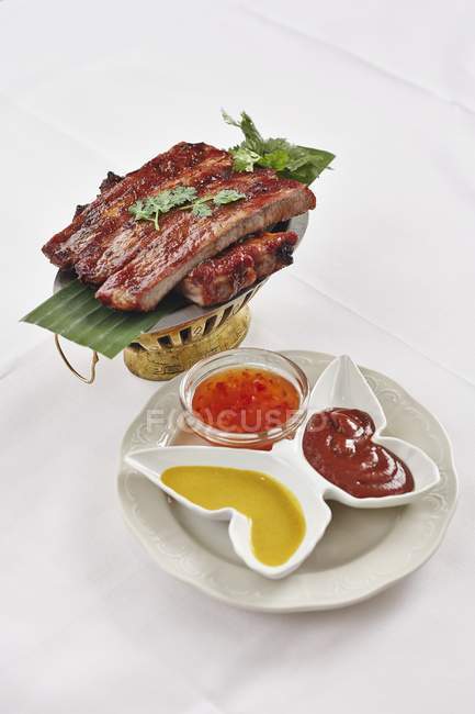 Spare ribs with sauces — Stock Photo