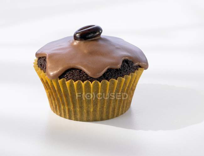 Muffin with coffee bean — Stock Photo