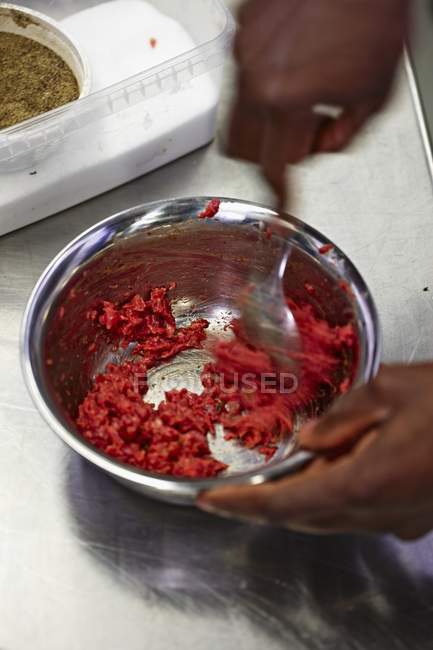Hands mixing Minced meat with spices — Stock Photo