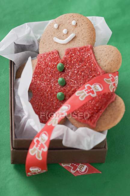 Gingerbread man in paper — Stock Photo