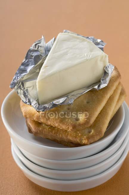 Processed cheese in foil — Stock Photo