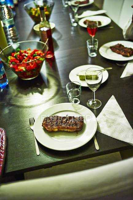 Grilled steaks with salad — Stock Photo