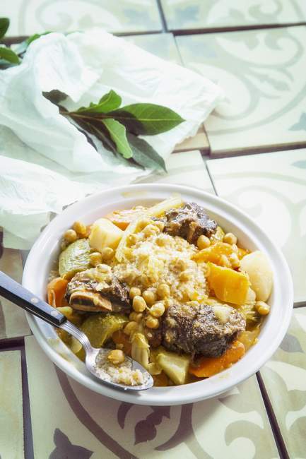 Serving of couscous with vegetables and beef — Stock Photo