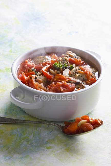 Fish and tomato stew in pot — Stock Photo