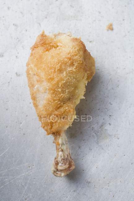 Breaded chicken leg — Stock Photo