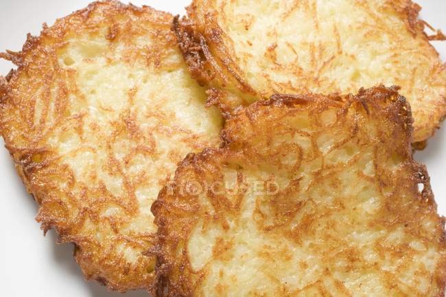 Fried potato rostis — Stock Photo