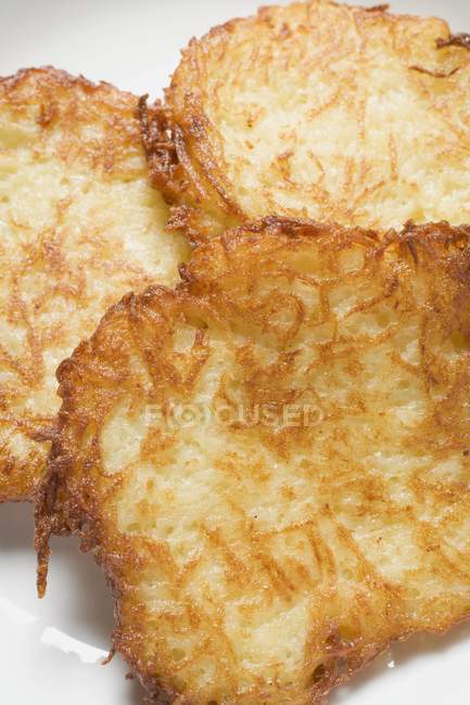 Potato rostis on plate — Stock Photo