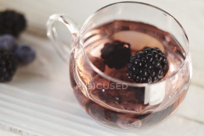 Glass cup of blackberry punch — Stock Photo