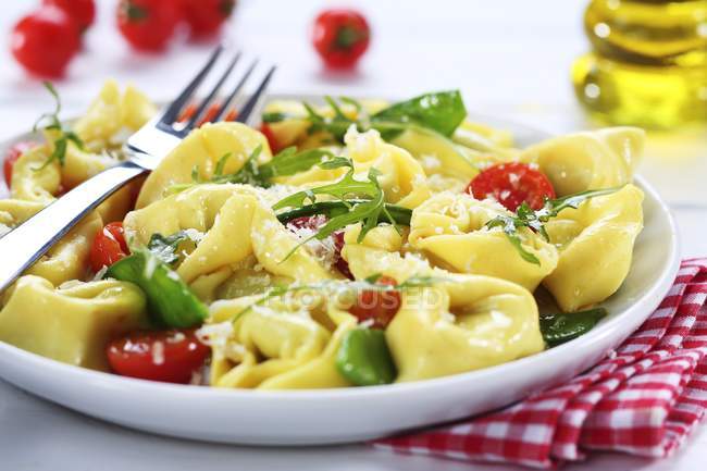 Tortellini pasta with cherry tomatoes — Stock Photo
