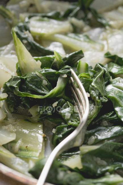 Raw green Chard with fork — Stock Photo