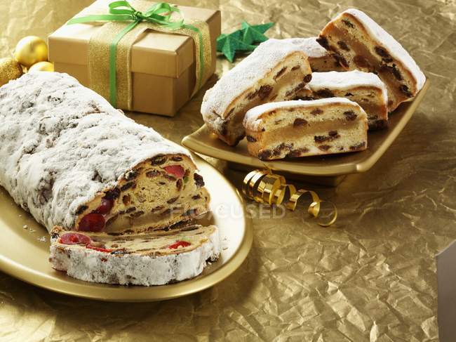 Christmas stollen with gift — Stock Photo