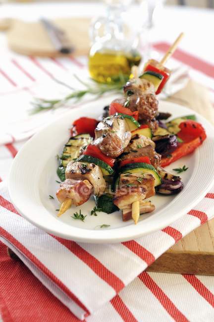 Barbecued kebabs with sausage — Stock Photo
