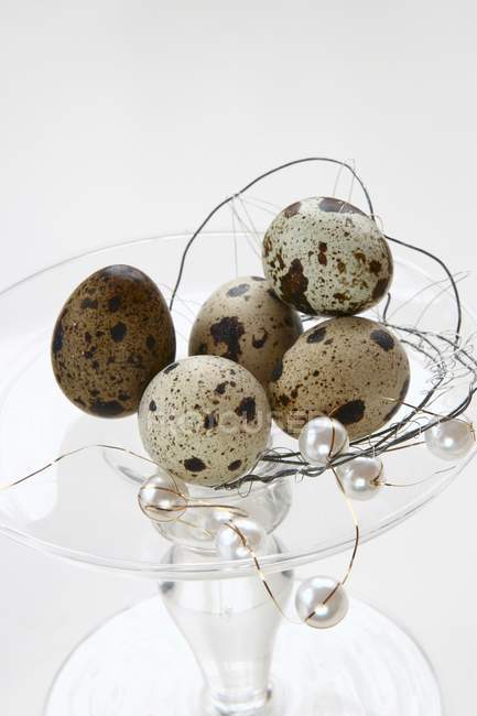 Quail eggs on tiered stand — Stock Photo