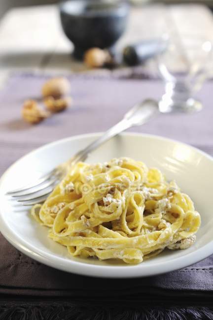 Tagliatelle pasta with sauce — Stock Photo