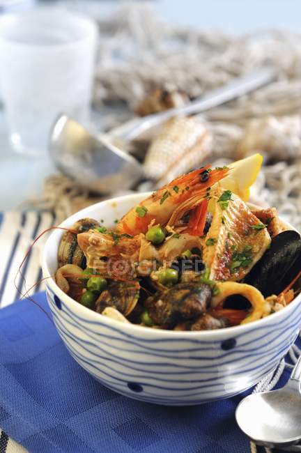 Seafood soup with tomatoes — Stock Photo