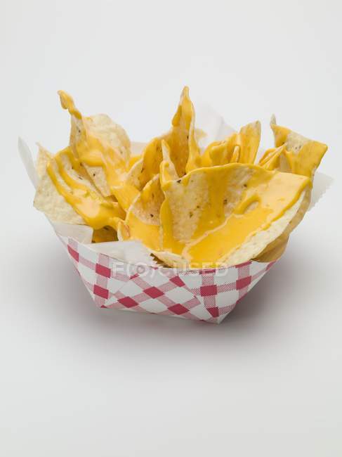 Nachos with cheese sauce — Stock Photo