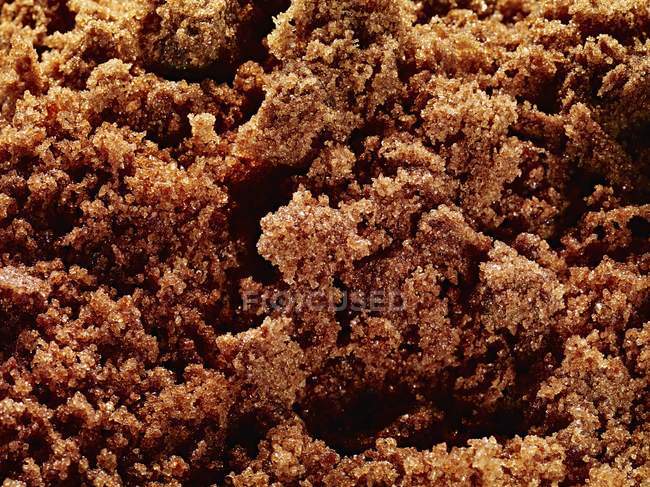 Muscovado brown sugar in heap — Stock Photo