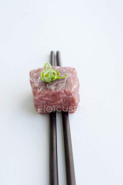 Wagyu beef on chopsticks — Stock Photo