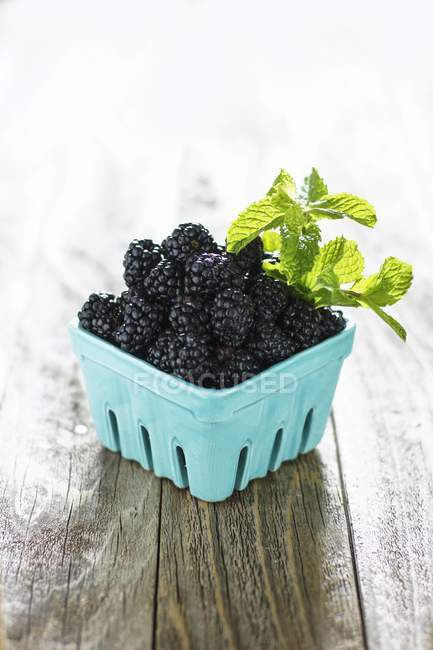 Blackberries in cardboard container — Stock Photo