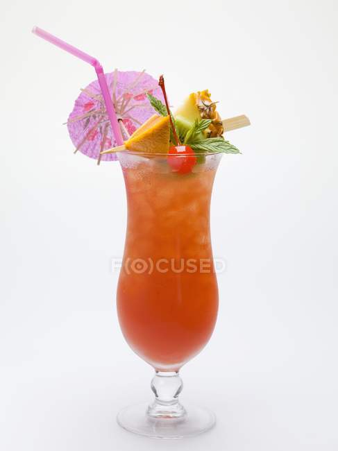 Cocktail with fruit and umbrella — Stock Photo
