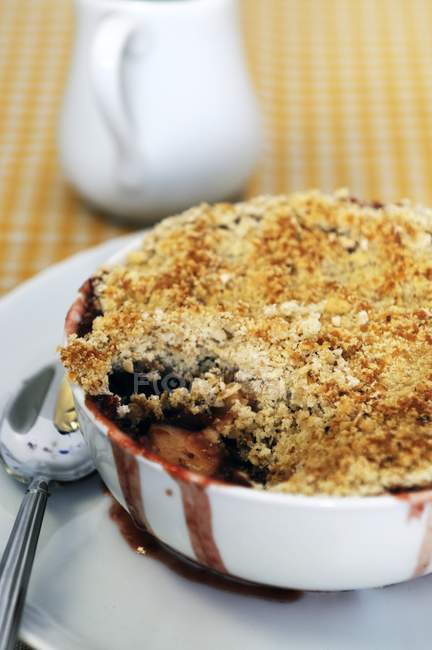 Closeup view of rhubarb and apple Crumble in  baking dish — Stock Photo