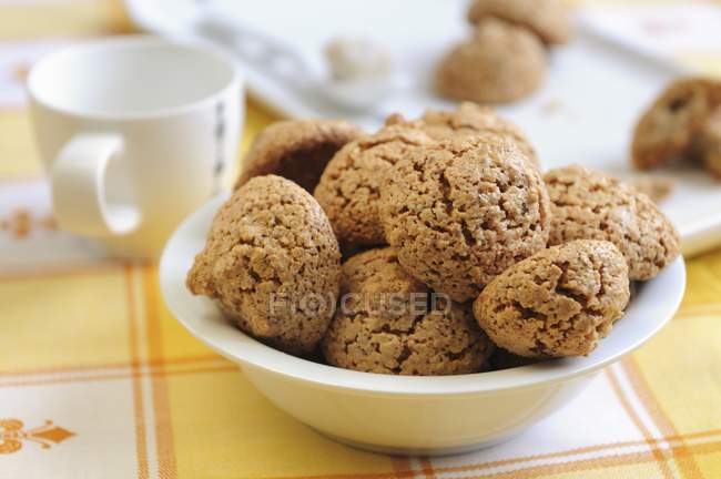 Hazelnut macaroons with cup — Stock Photo