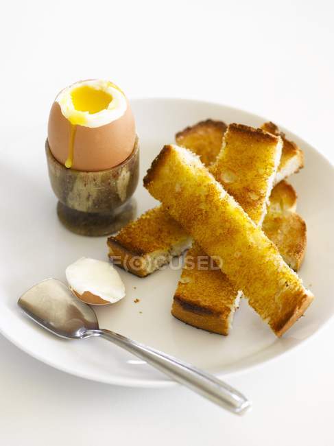 Soft-boiled egg and croutons — Stock Photo