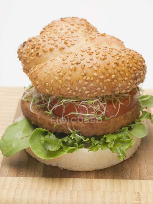 Burger with sprouts and tomato — Stock Photo
