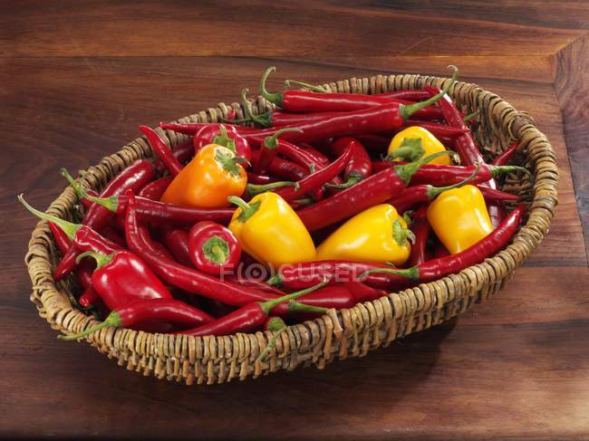 Fresh chillies and yellow peppers — Stock Photo
