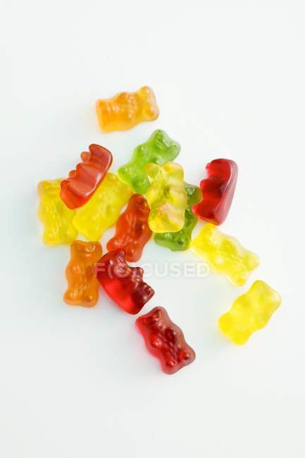 Closeup view of gummie bears on white surface — Stock Photo