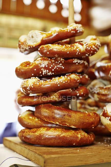 Stack of pretzels on cutting board — Stock Photo