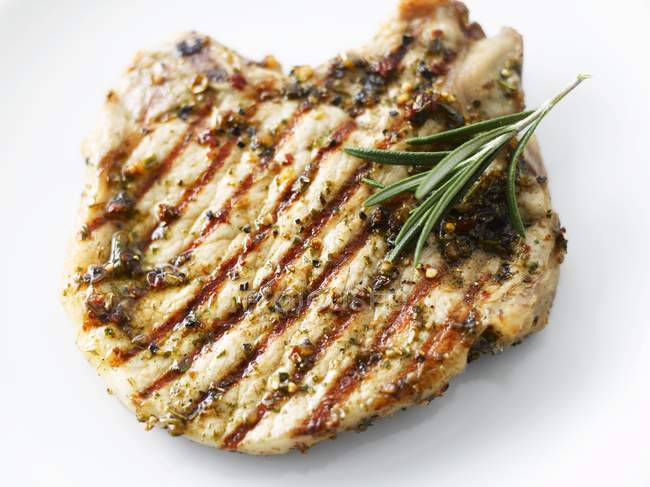 Grilled pork chop with rosemary — Stock Photo