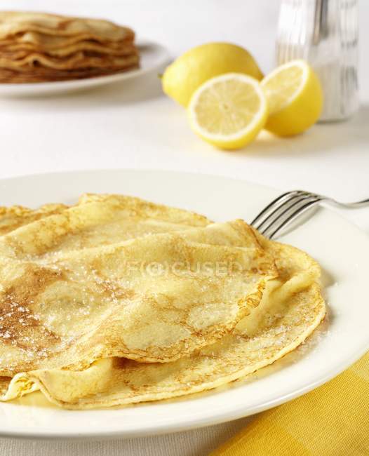 Pancakes with lemon and sugar — Stock Photo