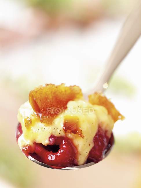Spoonful of creme brulee — Stock Photo