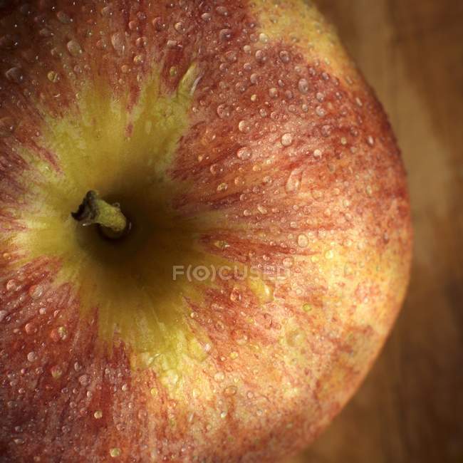 Apple with drops of water — Stock Photo
