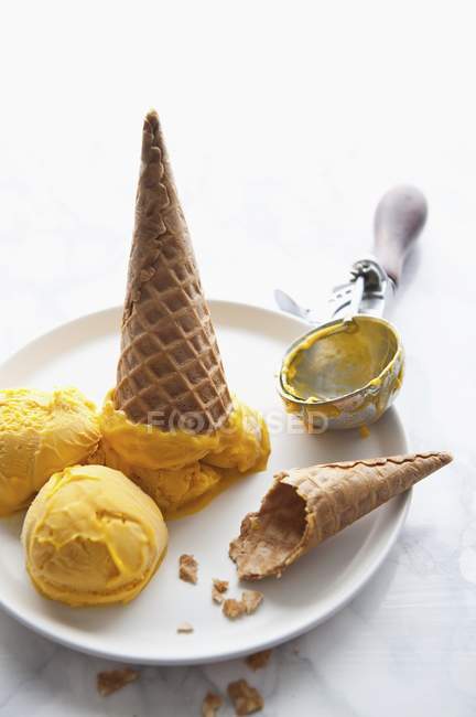 Mango sorbet with ice cream cones — Stock Photo