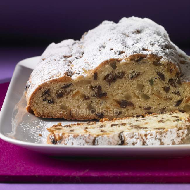 Butter stollen dusted with icing sugar — Stock Photo