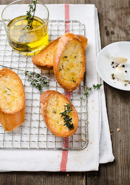 Elevated view of garlic bread with thyme — Stock Photo