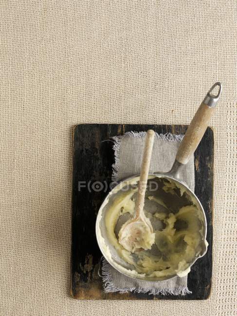 Remains of mashed potato in saucepan — Stock Photo