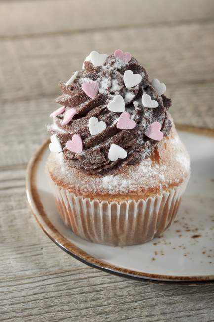 Cupcake decorated with chocolate buttercream — Stock Photo