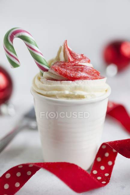 Cupcake decorated with candy cane — Stock Photo