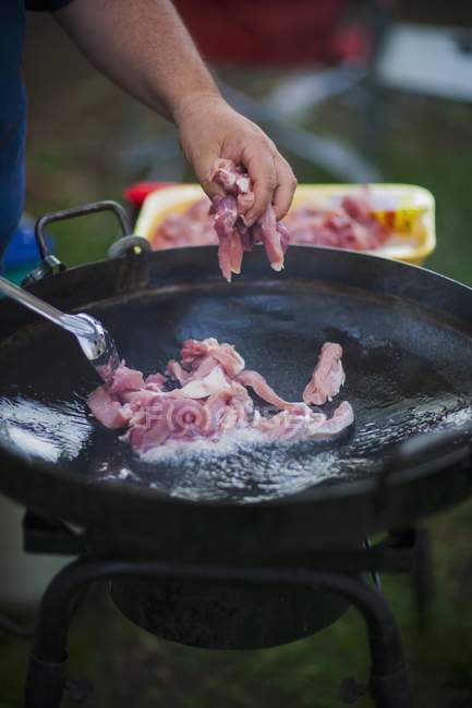 Pork being fried — Stock Photo