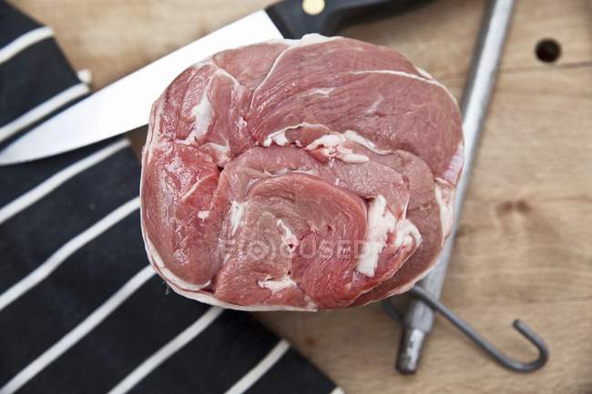 Raw rolled shoulder of lamb — Stock Photo