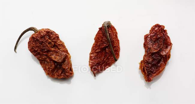 Dried naga jolokia chili peppers — Stock Photo