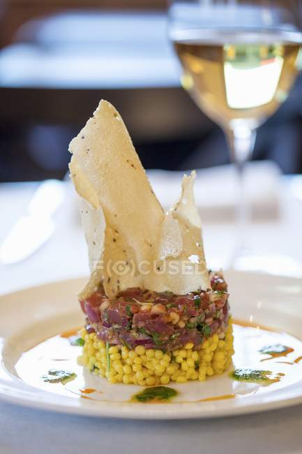 Tuna tartare on saffron couscous — Stock Photo