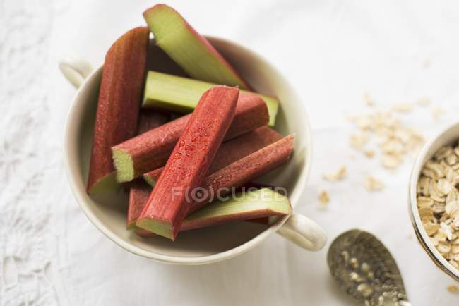 Pieces of rhubarb in cup — Stock Photo